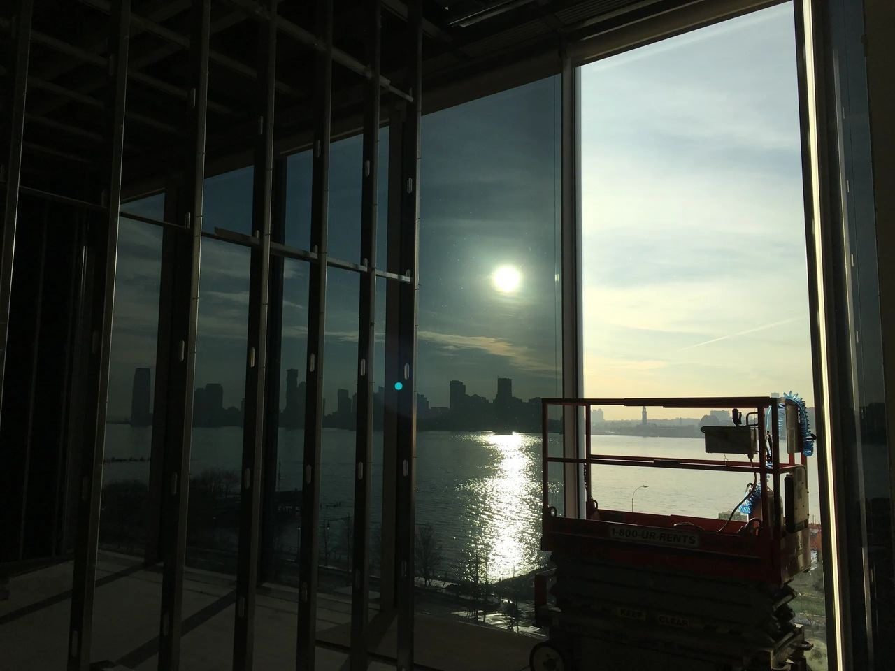 A view of the sun from inside a building.